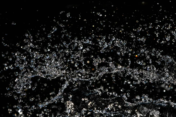 Vattendroppar Luften Mörk Bokeh Bakgrund — Stockfoto