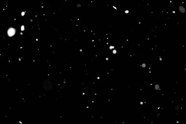 Kar fırtınası doku. Siyah arka plan, ışıkları bokeh vurdu kar taneleri havada uçan