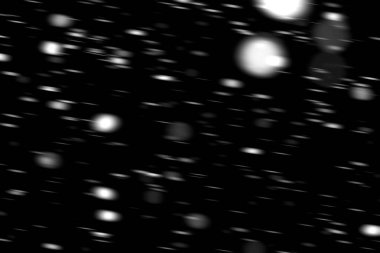 hareket bulanık siyah bir arka plan üzerinde beyaz noktalar kar