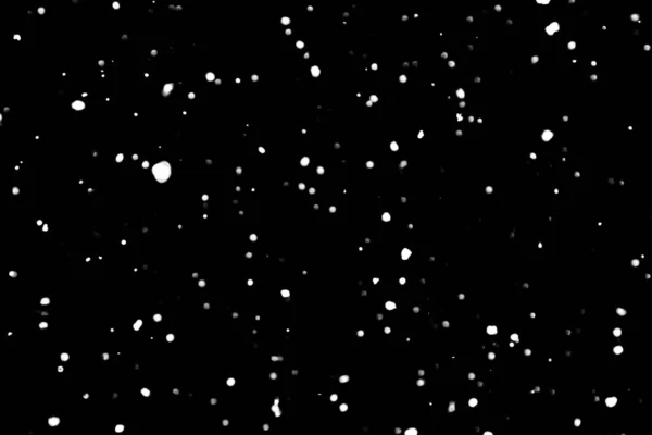 white dots on black snow bokeh background