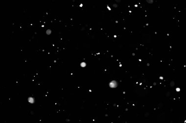 Kar fırtınası doku. Siyah arka plan, ışıkları bokeh vurdu kar taneleri havada uçan