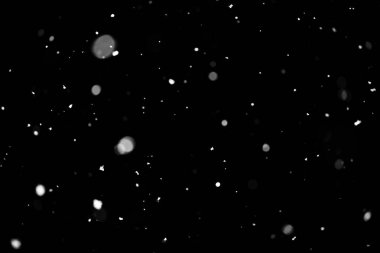 Kar fırtınası doku. Siyah arka plan, ışıkları bokeh vurdu kar taneleri havada uçan