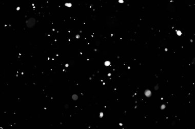 Kar fırtınası doku. Siyah arka plan, ışıkları bokeh vurdu kar taneleri havada uçan