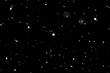 Kar fırtınası doku. Siyah arka plan, ışıkları bokeh vurdu kar taneleri havada uçan