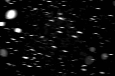 hareket bulanık siyah bir arka plan üzerinde beyaz noktalar kar