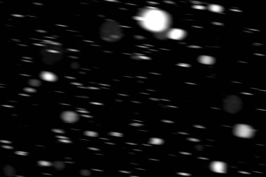 hareket bulanık siyah bir arka plan üzerinde beyaz noktalar kar