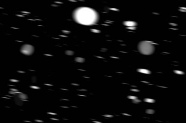 hareket bulanık siyah bir arka plan üzerinde beyaz noktalar kar