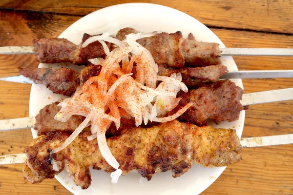 Fried meat on sticks, shish kebab