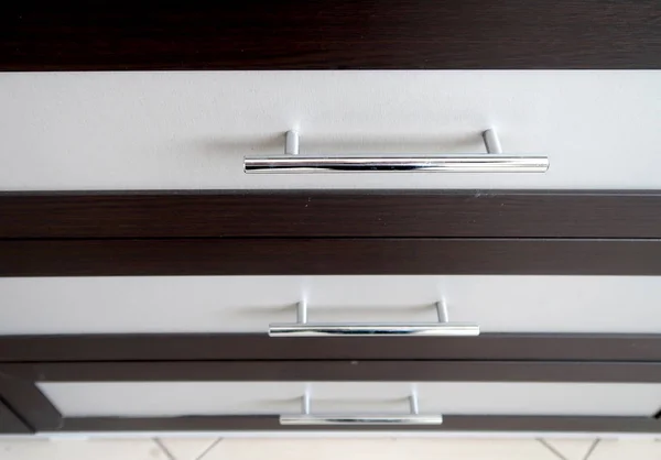 Metal handles on furniture