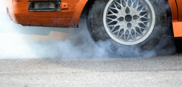 Drive cars, smoke from under the wheels of cars