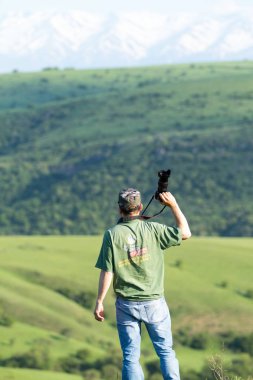 Shymkent, Kazakhstan - 04 May 2017: The guy with the camera, shoots the landscape.