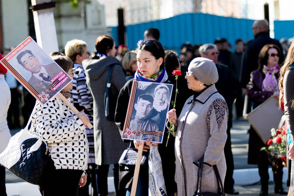 PETROPAVLOVSK MAY 9, 2016: residents in memorable procession "An immortal regiment", on May 9, 2016. Kazakhstan Petropavlovsk.