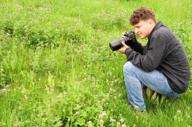 Shymkent, Kazakhstan - 04 May 2017: The guy with the camera, shoots the landscape.