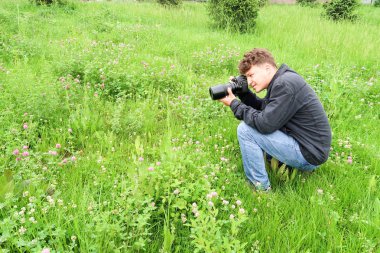Shymkent, Kazakhstan - 04 May 2017: The guy with the camera, shoots the landscape.