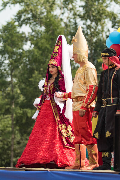 Petropavlovsk, Kazakhstan - July 28, 2016: Festival, 80 years of the North Kazakhstan region. Mass celebration ethnic folk, People in traditional costumes celebrate on the streets Petropavlovsk.