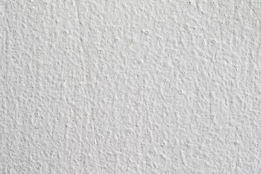 Arka plan doku. Beyaz beton duvar. Yüzeyi küçük çatlaklar.