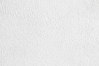 Arka plan doku. Beyaz beton duvar. Yüzeyi küçük çatlaklar.