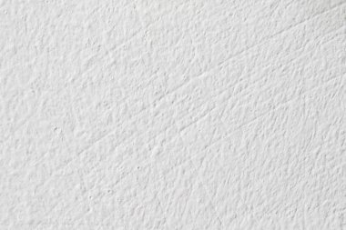 Arka plan doku. Beyaz beton duvar. Yüzeyi küçük çatlaklar.