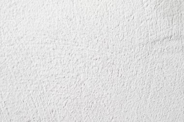 Arka plan doku. Beyaz beton duvar. Yüzeyi küçük çatlaklar.