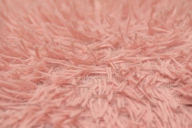 kürk halı. Pembe doğal yün katlanmış doku arka plan ile. Pamuk yün, beyaz yün halı