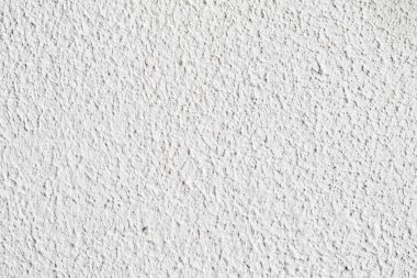 Arka plan doku. Beyaz beton duvar. Yüzeyi küçük çatlaklar.