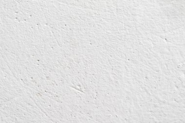 Arka plan doku. Beyaz beton duvar. Yüzeyi küçük çatlaklar.