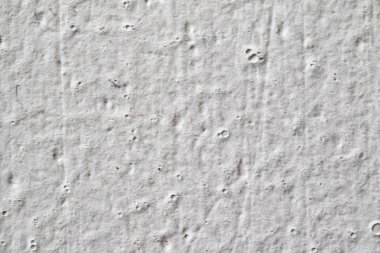 Arka plan doku. Beyaz beton duvar. Yüzeyi küçük çatlaklar.
