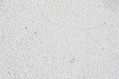 Arka plan doku. Beyaz beton duvar. Yüzeyi küçük çatlaklar.