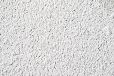 Arka plan doku. Beyaz beton duvar. Yüzeyi küçük çatlaklar.