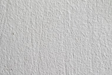 Arka plan doku. Beyaz beton duvar. Yüzeyi küçük çatlaklar.