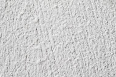 Arka plan doku. Beyaz beton duvar. Yüzeyi küçük çatlaklar.