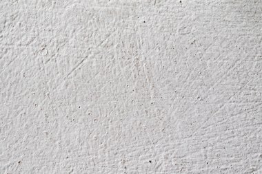 Arka plan doku. Beyaz beton duvar. Yüzeyi küçük çatlaklar.