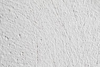 Arka plan doku. Beyaz beton duvar. Yüzeyi küçük çatlaklar.
