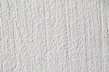 Arka plan doku. Beyaz beton duvar. Yüzeyi küçük çatlaklar.