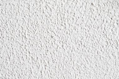 Arka plan doku. Beyaz beton duvar. Yüzeyi küçük çatlaklar.