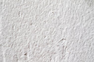 Arka plan doku. Beyaz beton duvar. Yüzeyi küçük çatlaklar.