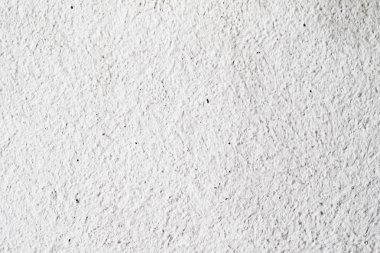 Arka plan doku. Beyaz beton duvar. Yüzeyi küçük çatlaklar.