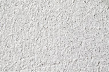 Arka plan doku. Beyaz beton duvar. Yüzeyi küçük çatlaklar.