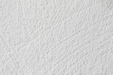 Arka plan doku. Beyaz beton duvar. Yüzeyi küçük çatlaklar.