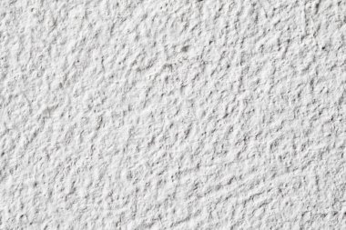 Arka plan doku. Beyaz beton duvar. Yüzeyi küçük çatlaklar.