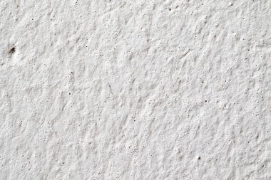 Arka plan doku. Beyaz beton duvar. Yüzeyi küçük çatlaklar.