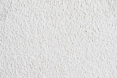 Arka plan doku. Beyaz beton duvar. Yüzeyi küçük çatlaklar.