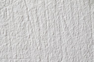 Arka plan doku. Beyaz beton duvar. Yüzeyi küçük çatlaklar.