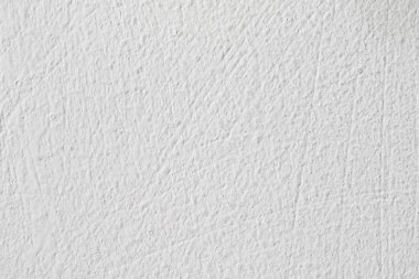 Arka plan doku. Beyaz beton duvar. Yüzeyi küçük çatlaklar.