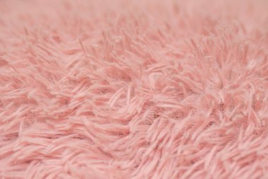 kürk halı. Pembe doğal yün katlanmış doku arka plan ile. Pamuk yün, beyaz yün halı