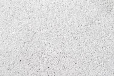 Arka plan doku. Beyaz beton duvar. Yüzeyi küçük çatlaklar.