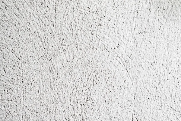 Background texture.White concrete wall. Small cracks on the surface.