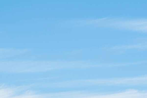 Soft clouds. Beautiful sky background. Blue sky with white clouds. Clear day and good weather.