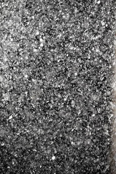 Sıçramaları Beyaz Bokeh Karanlık Bir Arka Planda Odak Dışında Bulanık — Stok fotoğraf