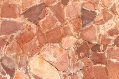 Arka plan olarak kırmızı granit taş duvar